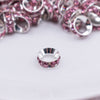 close up view of a pile of 10mm Pink Large Hole Rondelle Spacer Beads - Set of 20