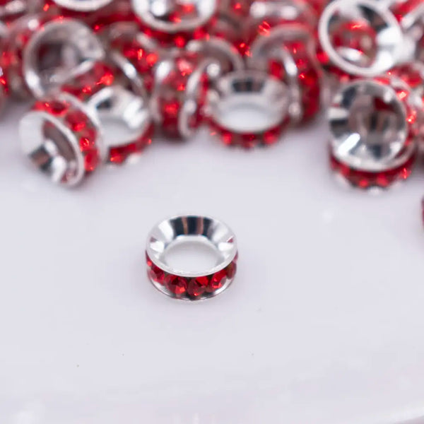 close up view of a pile of 10mm Red Large Hole Rondelle Spacer Beads - Set of 20