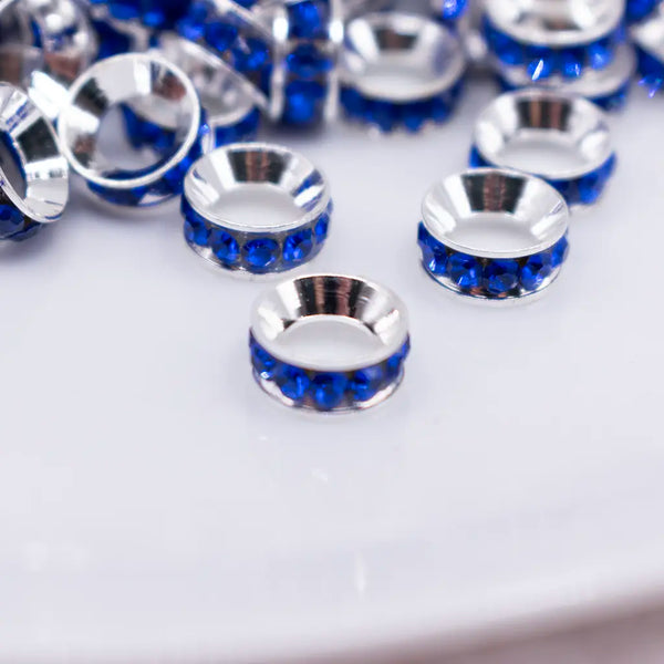 close up view of a pile of 10mm Royal Blue Large Hole Rondelle Spacer Beads - Set of 20