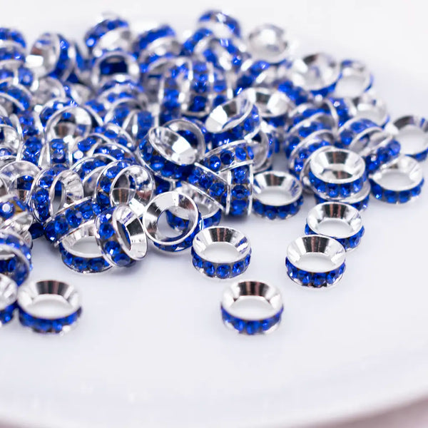 front view of a pile of 10mm Royal Blue Large Hole Rondelle Spacer Beads - Set of 20