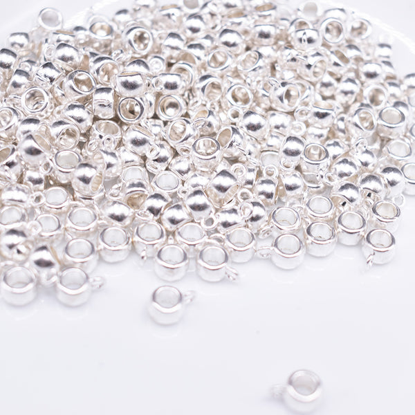 front view of a pile of Large Silver Spacer with Charm Mount - Set of 10