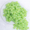 top view of a pile of 12mm Apple Green Rhinestone AB Bubblegum Beads