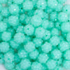 close up view of a pile of 12mm Aqua Blue Neon Rhinestone Bubblegum Beads