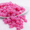front view of a pile of 12mm Bright Pink Rhinestone AB Bubblegum Beads