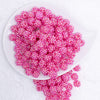 top view of a pile of 12mm Bright Pink Rhinestone AB Bubblegum Beads