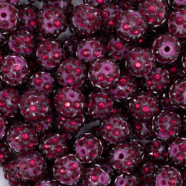 close up view of a pile of 12mm Cranberry Red with Clear Rhinestone Bubblegum Beads