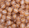 close up view of a pile of 12mm Gold Cats Eye Acrylic Bubblegum Beads - 20 Count