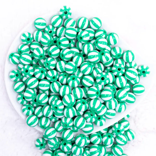 top view of a pile of 12mm Green with White Stripe Beach Ball Bubblegum Beads