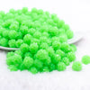 front view of a pile of 12mm Green Neon Rhinestone Bubblegum Beads