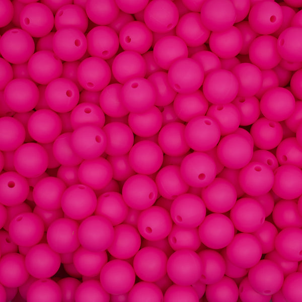 top view of a pile of 12mm Hot Pink Round Silicone Bead