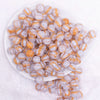 top view of a pile of 12mm Ice Blue Cats Eye Acrylic Bubblegum Beads - 20 Count