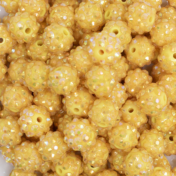 close up view of a pile of 12mm Lemon Yellow Rhinestone AB Bubblegum Beads