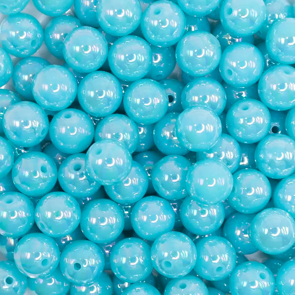 close up view of a pile of 12mm Blue Neon AB Solid Acrylic Bubblegum Beads