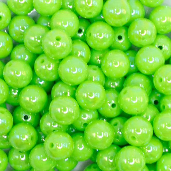 close up view of a pile of 12mm Neon Lime Green AB Solid Acrylic Bubblegum Beads