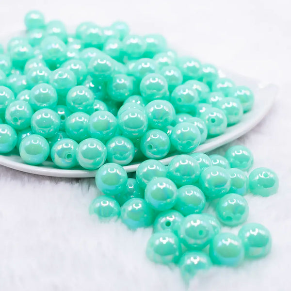 front view of a pile of 12mm Light Blue Blue Neon AB Solid Acrylic Bubblegum Beads