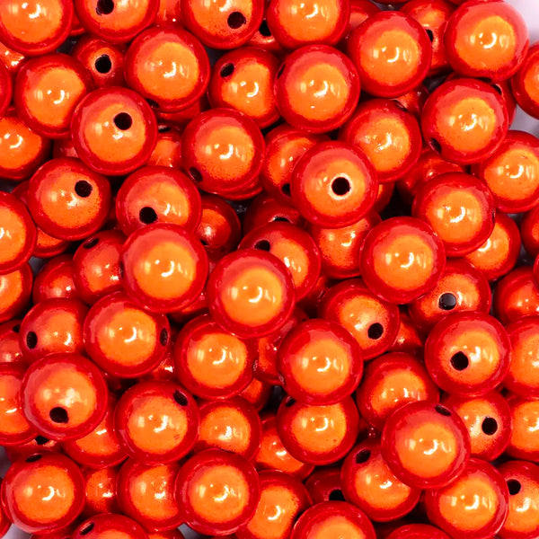 close up view of a pile of 12mm Orange Miracle Bubblegum Bead