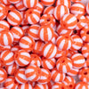 close up view of a pile of 12mm Orange with White Stripe Beach Ball Bubblegum Beads