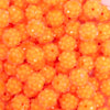 close up view of a pile of 12mm Orange Neon Rhinestone Bubblegum Beads