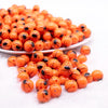 front of a pile of 12mm Orange with Black Spider Print Bubblegum Beads