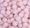 close up view of a pile of 12mm Pastel Pink Rhinestone AB Bubblegum Beads