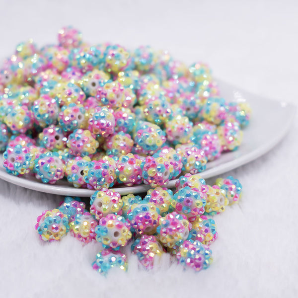 front view of a pile of 12mm Pink, Blue and Yellow Confetti Rhinestone AB Bubblegum Beads