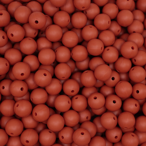 top view of a pile of 12mm Red/Brown Round Silicone Bead