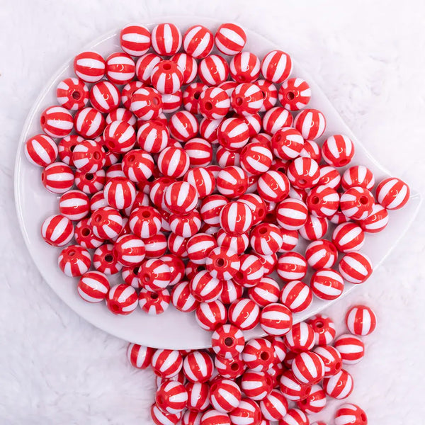 top view of a pile of 12mm Red with White Stripe Beach Ball Bubblegum Beads