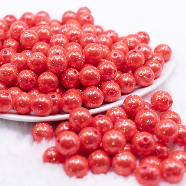 front view of a  pile of 12mm Sunset Red with Glitter Faux Pearl Acrylic Bubblegum Beads - 20 Count