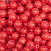 close up view of a  pile of 12mm Sunset Red with Glitter Faux Pearl Acrylic Bubblegum Beads - 20 Count