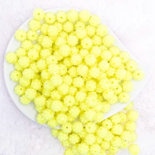 top view of a pile of 12mm Yellow Neon Rhinestone Bubblegum Beads