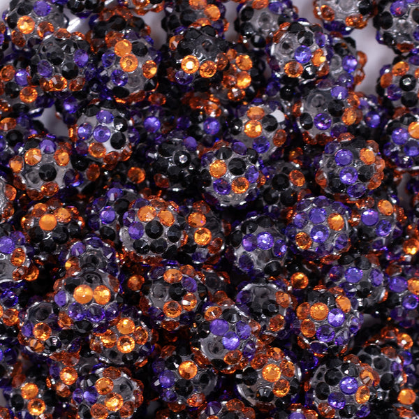 close up view of a pile of 12mm Orange, Purple and Black Confetti Rhinestone AB Bubblegum Beads - 10 & 20 Count