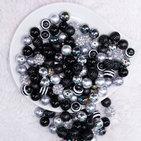 top view of a pile of 12mm Black and Silver Acrylic Bubblegum Bead Mix
