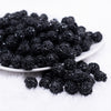 front view of a pile of 12mm Black Sequin Confetti Bubblegum Beads