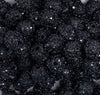 close up view of a pile of 12mm Black Sequin Confetti Bubblegum Beads