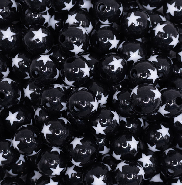 close up view of a pile of 12mm Black with White Stars Bubblegum Beads