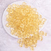 top view of a pile of 12mm Blonde Yellow Transparent Cube Faceted Bubblegum Beads