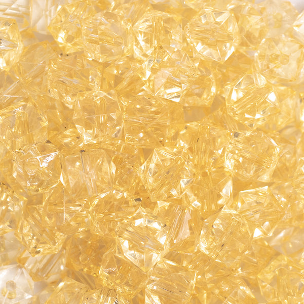 close up view of a pile of 12mm Blonde Yellow Transparent Cube Faceted Bubblegum Beads