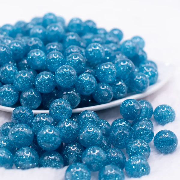 front view of a pile of 12mm Blue Shimmer Glitter Sparkle Bubblegum Beads - 20 Count