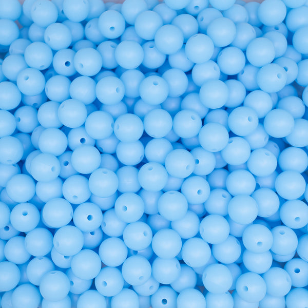 top view of a pile of 12mm Blue Glow In The Dark Silicone Bead
