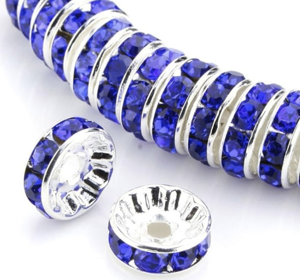 front view of a pile of 12mm Blue Rhinestone Rondelle Spacer Beads - Set of 10