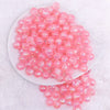 top view of a pile of 12mm Bright Pink Opal Bubblegum Beads - 20 Count