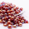 front view of a pile of 12mm Brown / Orange Marbled Bubblegum Bead