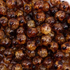 close up view of a pile of 12mm Brown Crackle Leopard Print Bubblegum Beads - 20 Count