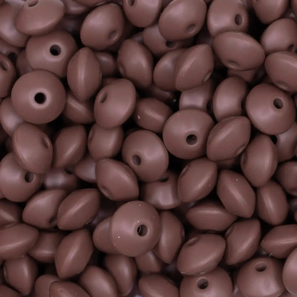 Top view of a pile of 12mm brown silicone lentil spacer beads