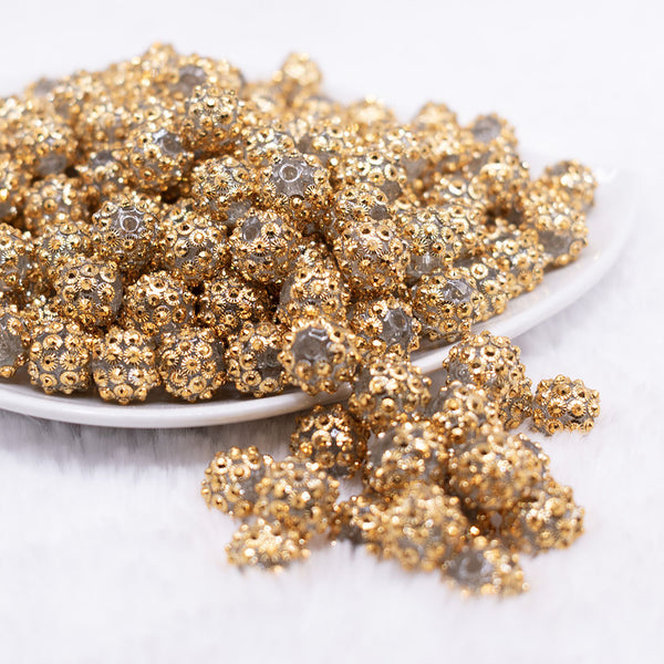 front view of a pile of 12mm Gold Flower Rhinestone AB Bubblegum Beads