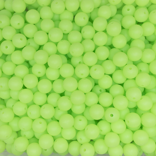 front view of a pile of 12mm Green Glow In The Dark Silicone Bead