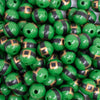 close up view of a pile of 12mm Green Santa's Belt Acrylic Bubblegum Beads - 20 Count