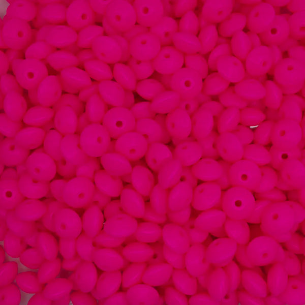 top view of a pile of 12mm Hot Pink Lentil Silicone Bead