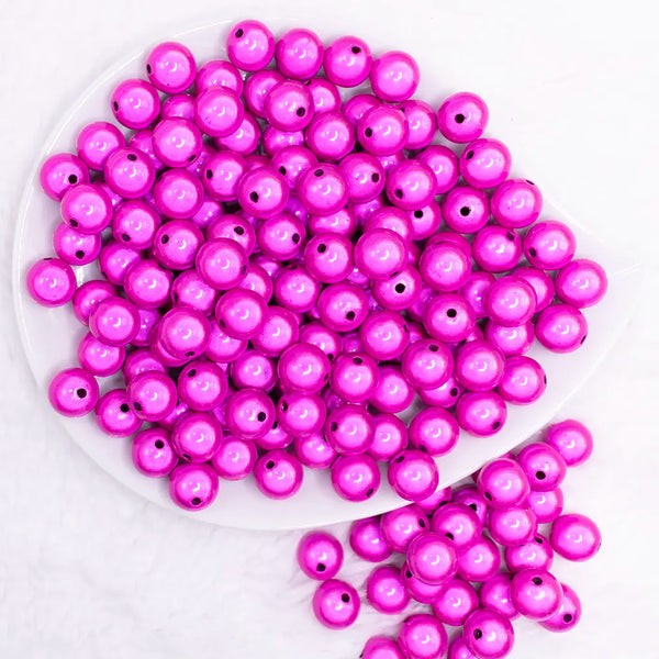 top view of a pile of 12mm Hot Pink Miracle Bubblegum Bead