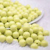 front view of a pile of 12mm Key Lime Green Acrylic Bubblegum Beads - 20 & 50 Count